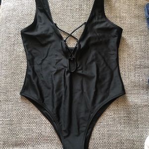 Black one-piece with deep-V tie